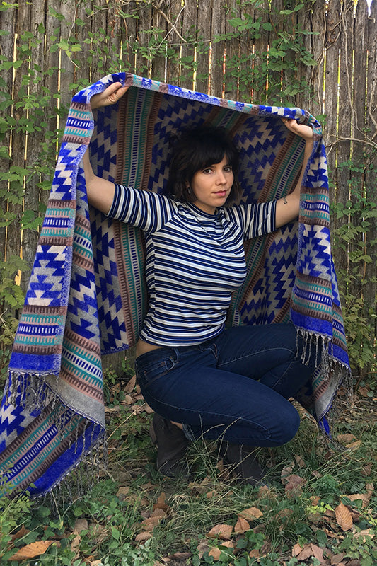 Modeling Mucho Merch-Southwest Style Chal in Blue Aztec