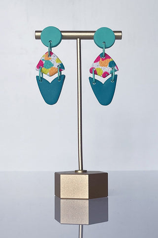 Get trendy with Clay Teal Confetti Statement Earrings - Earrings available at ShopMucho. Grab yours for $30 today!