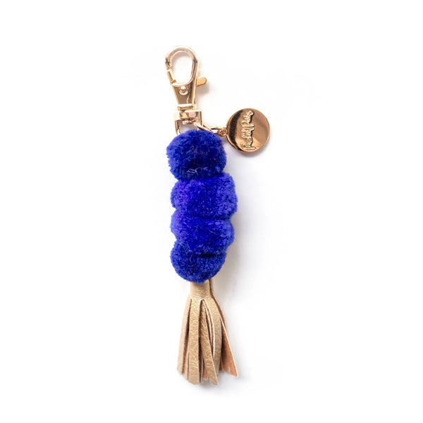 Get trendy with Pom Pom Keychain With Gold Tassel - Keychain available at ShopMucho. Grab yours for $7 today!